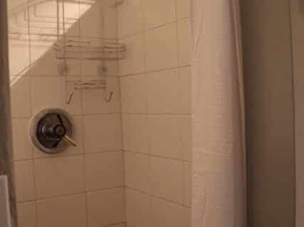 Clean shower with white tiles